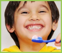 Smiling boy with toothbrush